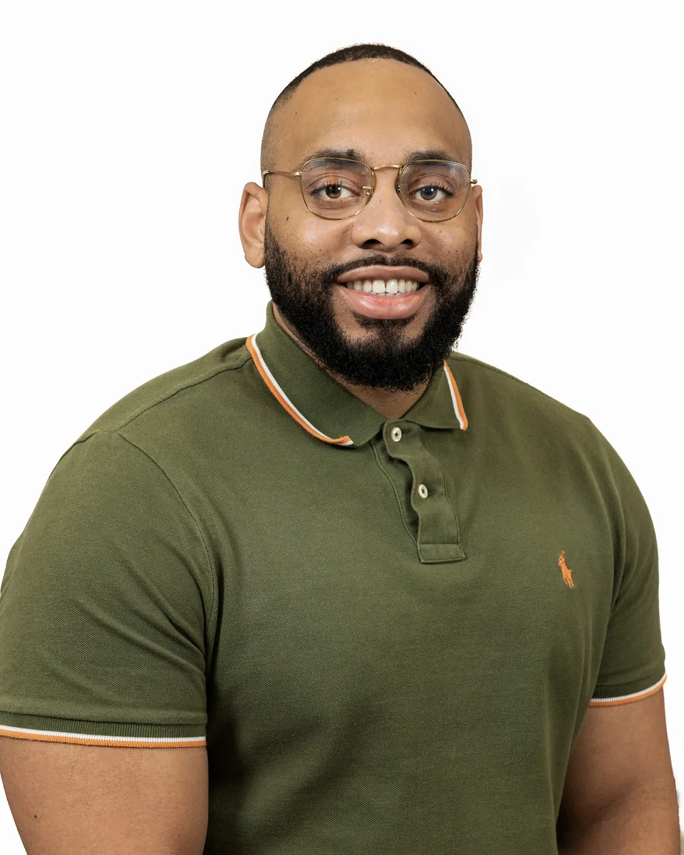 Professional headshot with studio backdrop