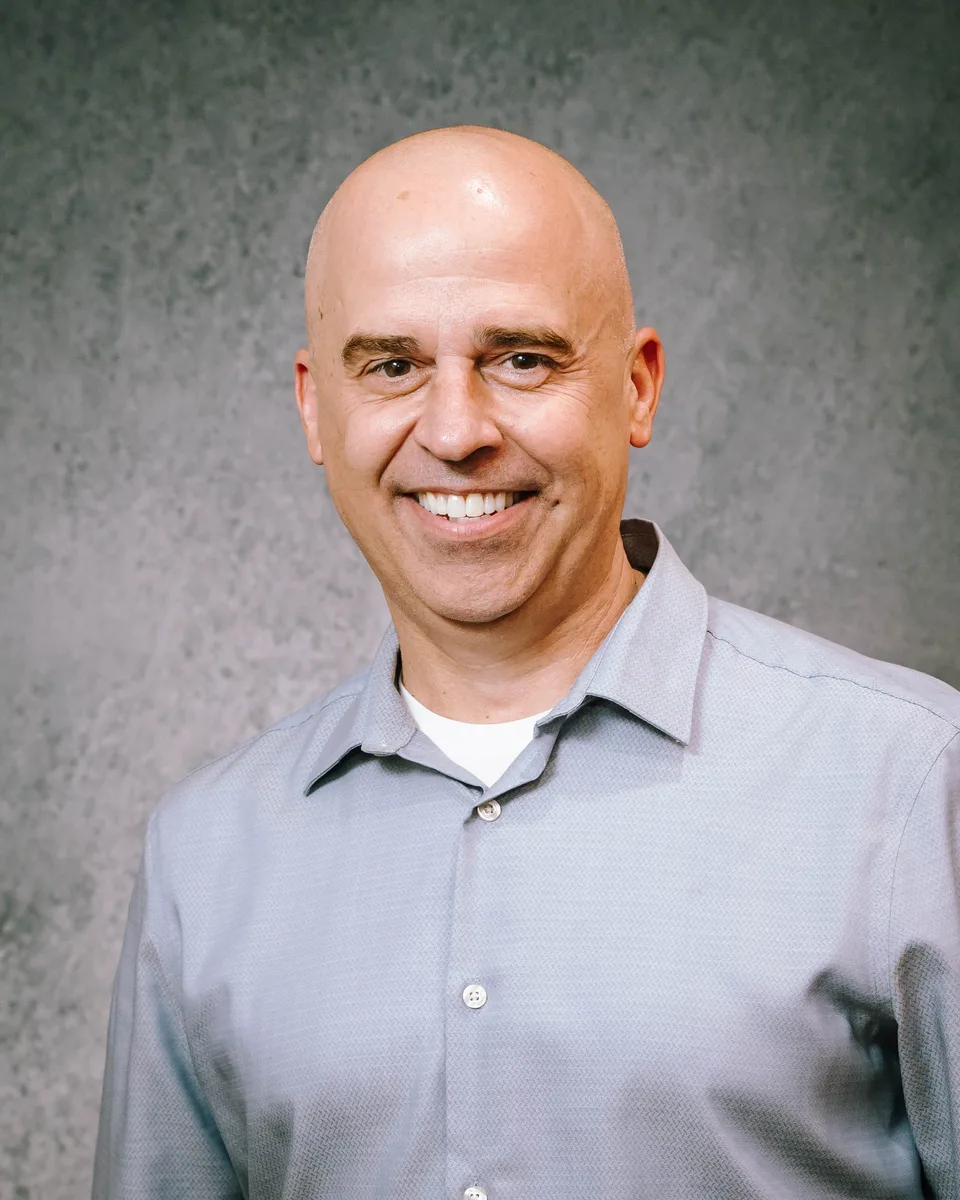 Team headshot with corporate backdrop