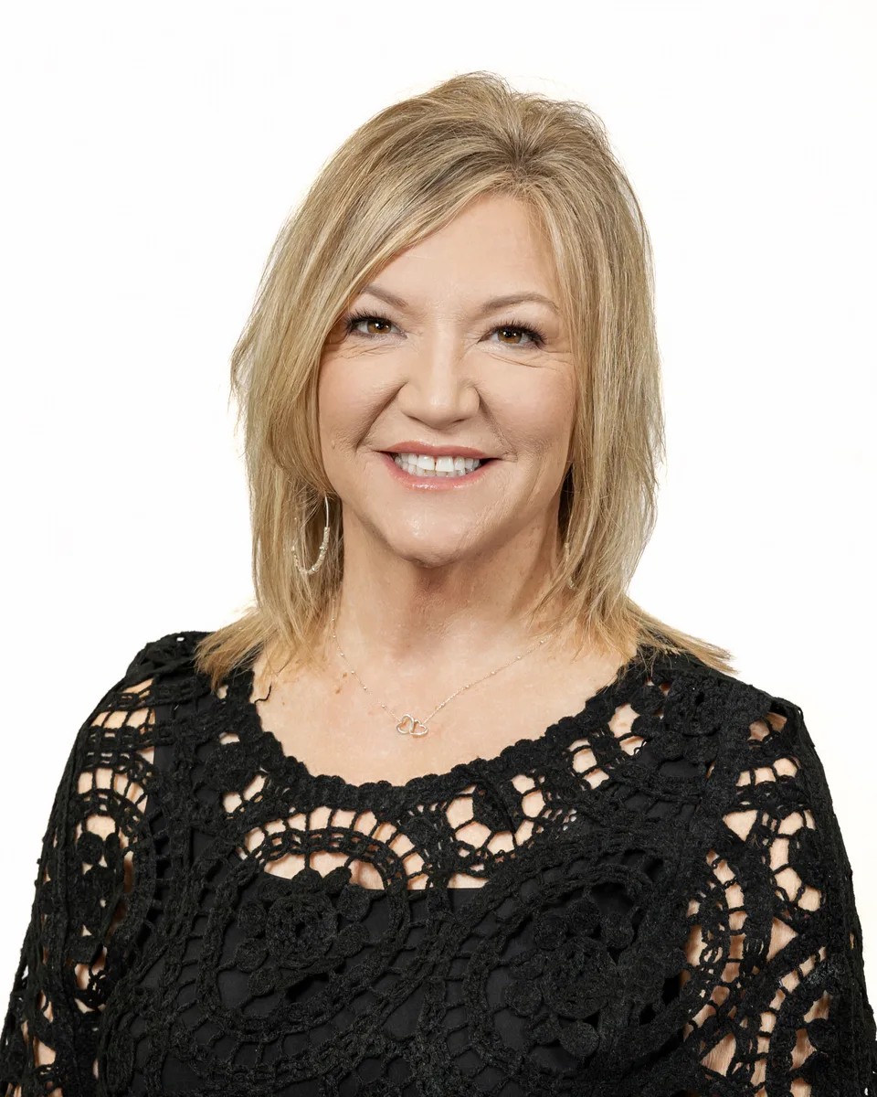 Business branding headshot with warm backdrop