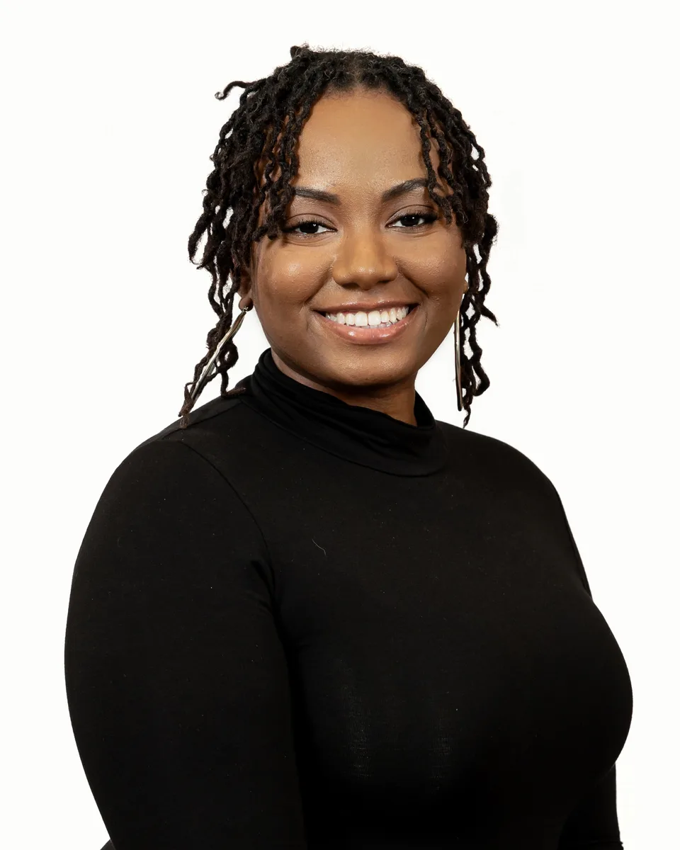 Professional headshot with inviting expression