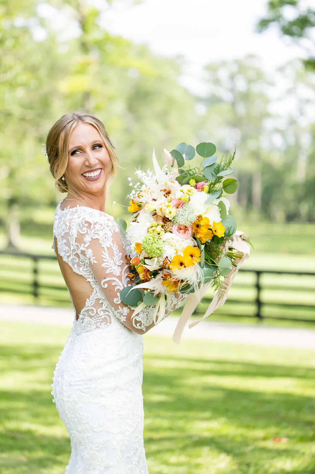 Bride with colorful summer bouquet
