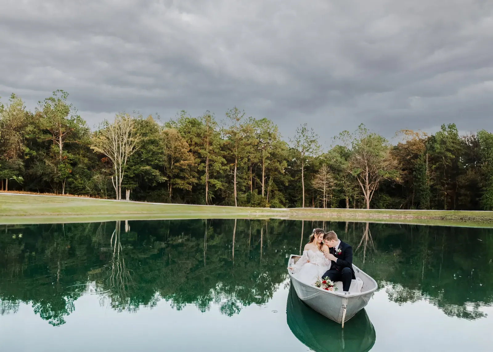 Romantic rowboat portrait on lake with reflection